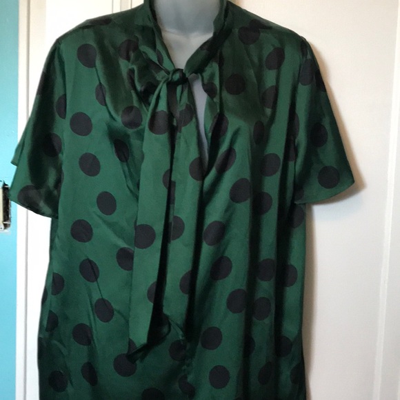 green and black polka dot blouse